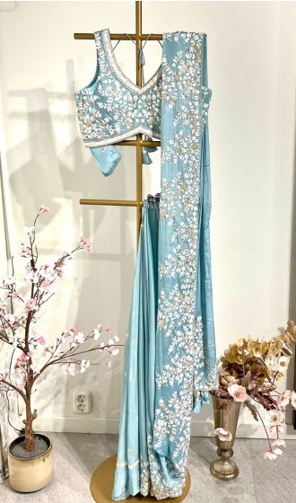 Powder blue saree with readymade blouse 